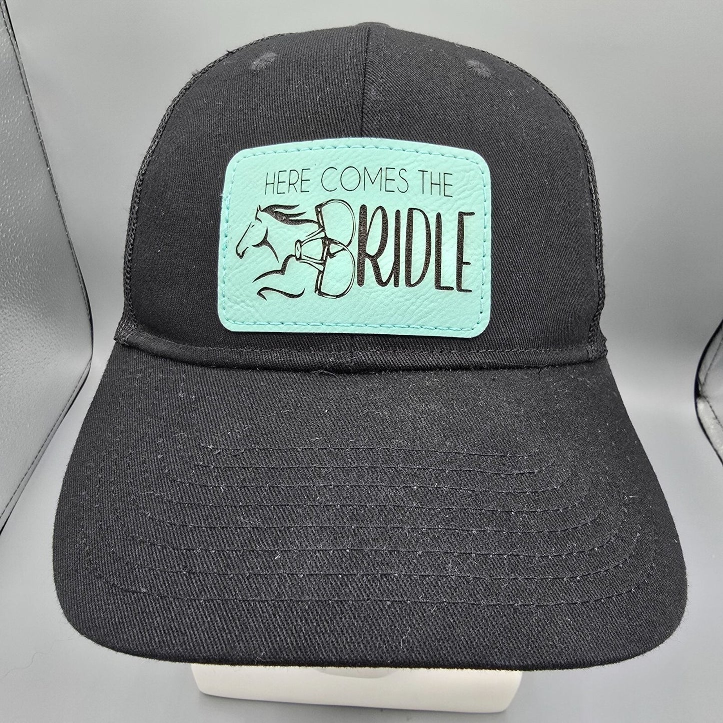 Here Comes The Bridle Port Authority Low-Profile Black Patch Logo Trucker Hat
