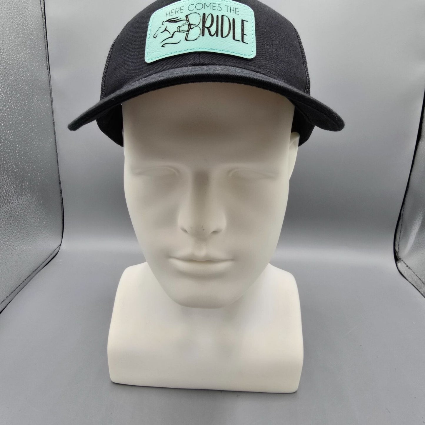 Here Comes The Bridle Port Authority Low-Profile Black Patch Logo Trucker Hat