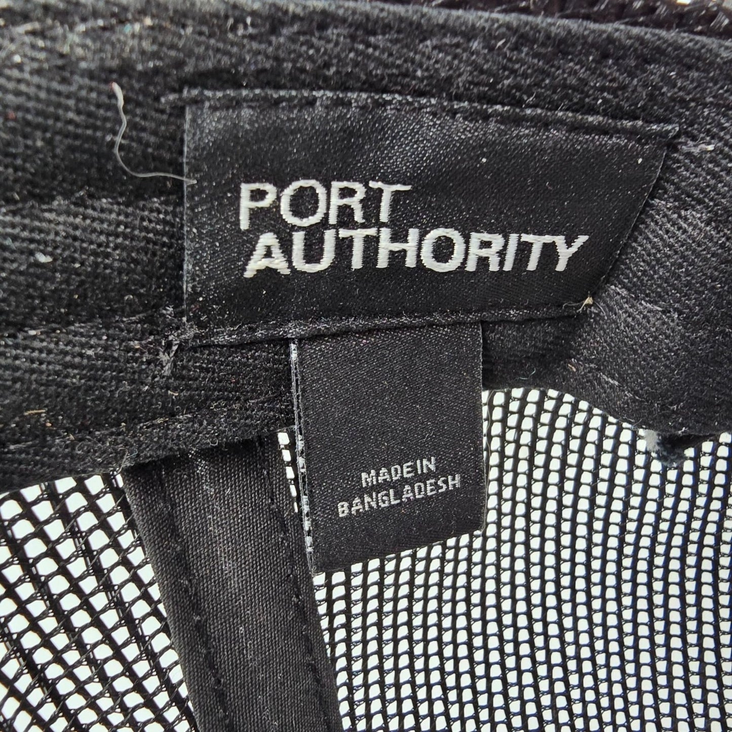 Here Comes The Bridle Port Authority Low-Profile Black Patch Logo Trucker Hat