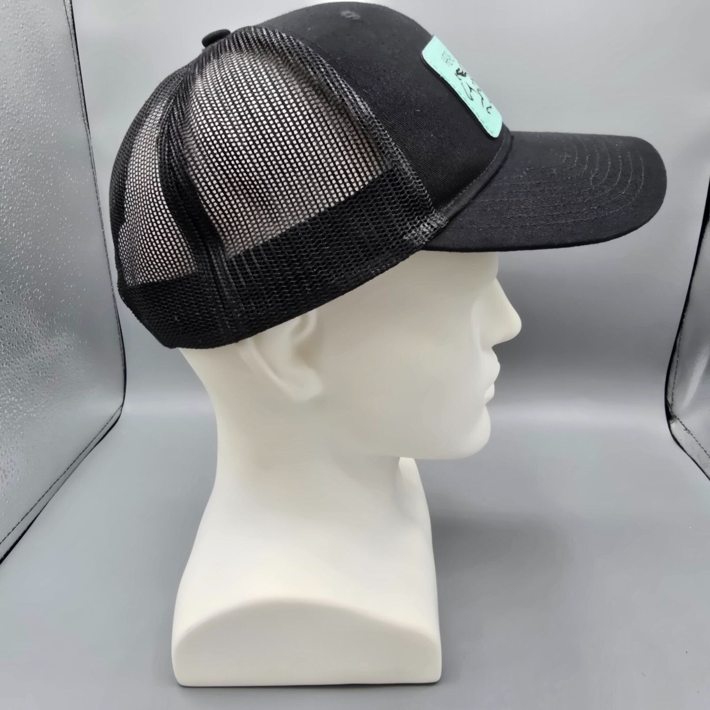 Here Comes The Bridle Port Authority Low-Profile Black Patch Logo Trucker Hat