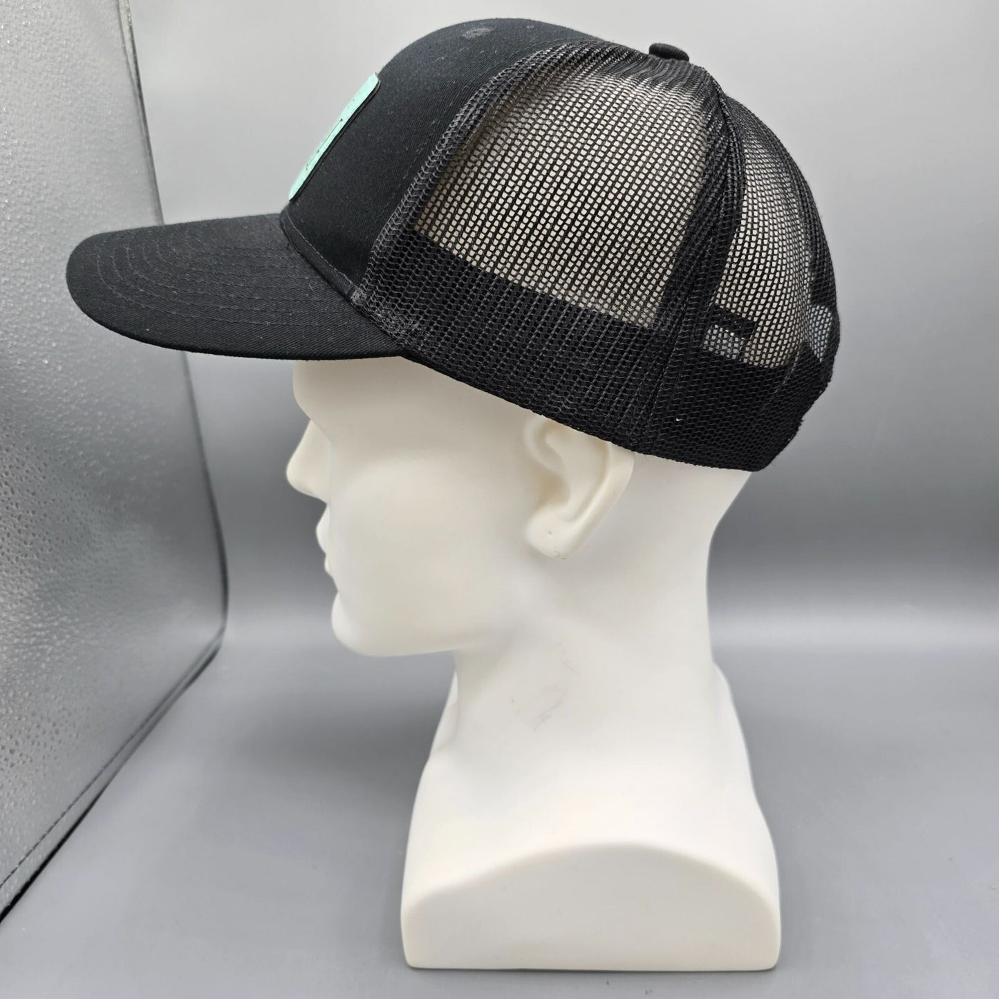 Here Comes The Bridle Port Authority Low-Profile Black Patch Logo Trucker Hat