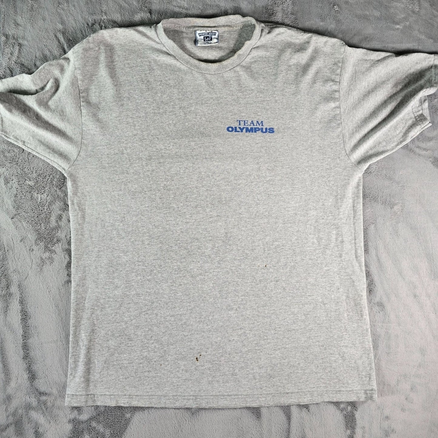 Stained Vintage 1990s Lee Premium Jersey Team Olympus Gray T-Shirt (XL)