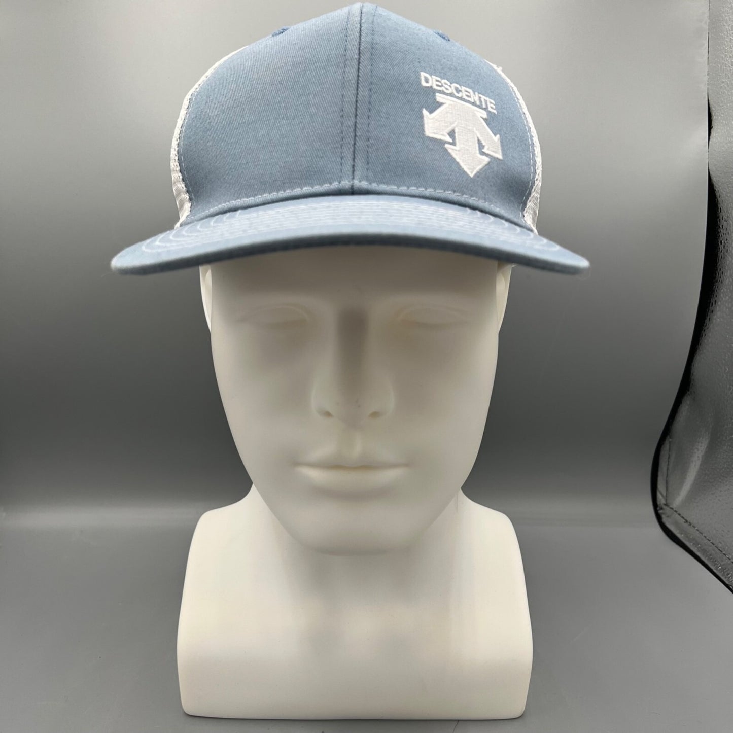Descente Skiing Mesh Back Six Panel Blue and White Embroidered Logo Trucker Hat