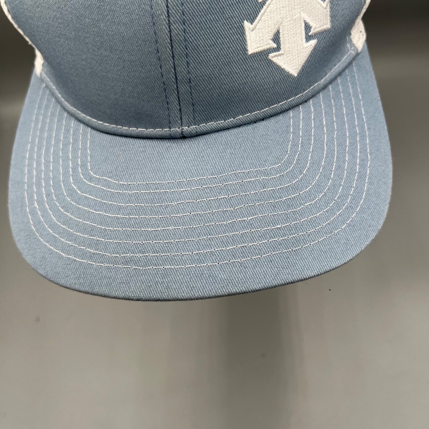Descente Skiing Mesh Back Six Panel Blue and White Embroidered Logo Trucker Hat