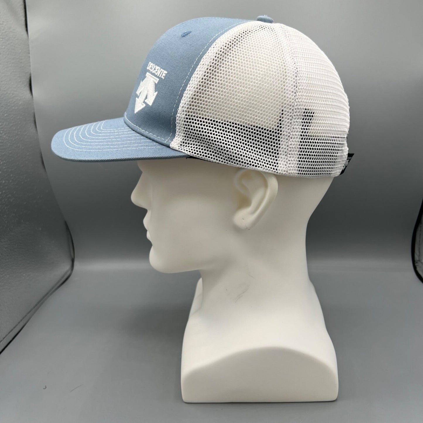 Descente Skiing Mesh Back Six Panel Blue and White Embroidered Logo Trucker Hat
