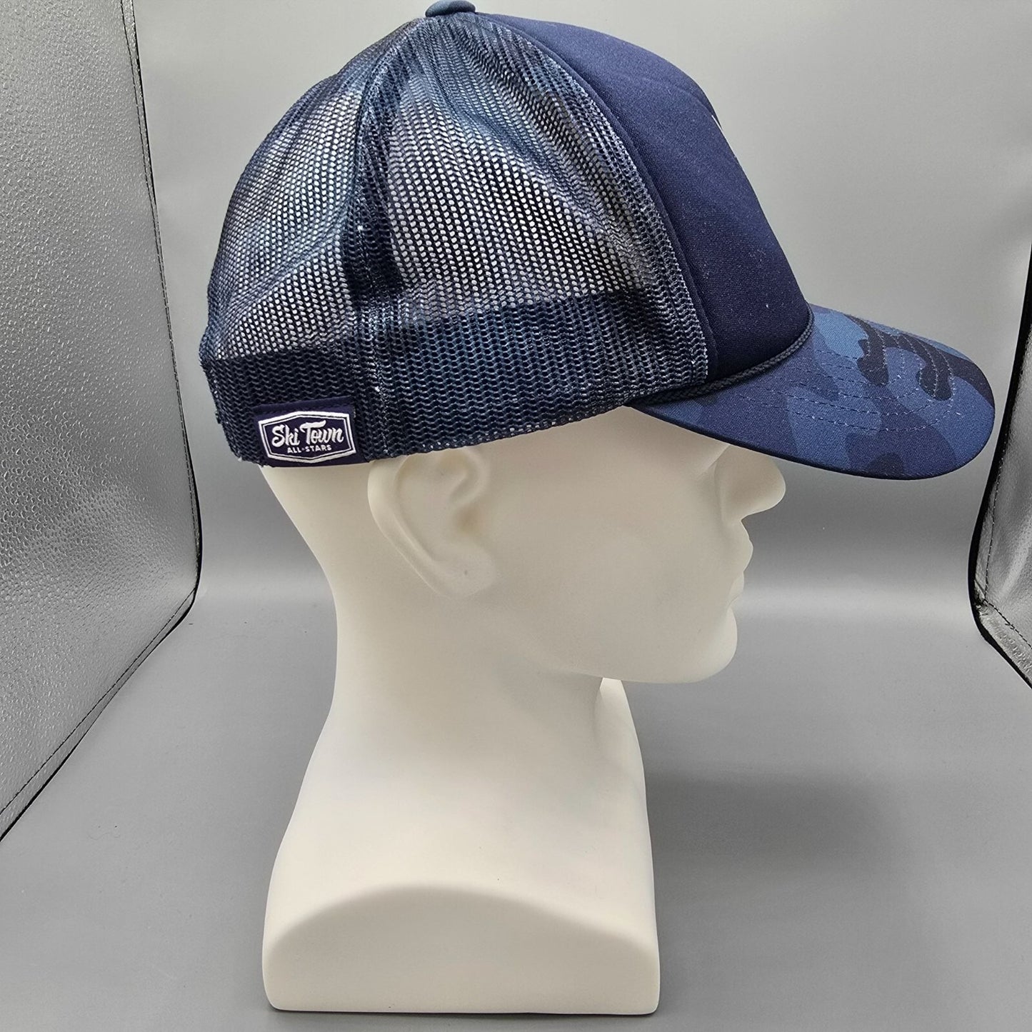 Ski Town All-Stars Vali Colorado US Rocky Central Blue Camouflage Trucker Hat