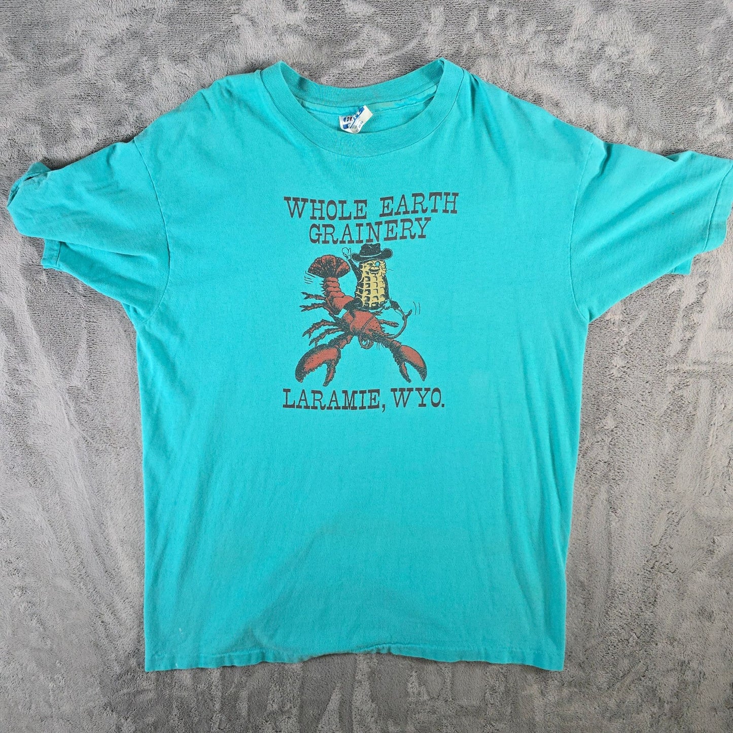 Vintage 1990s Hanes Beefy-T Whole Earth Grainery Laramie Wyoming T-Shirt (L)