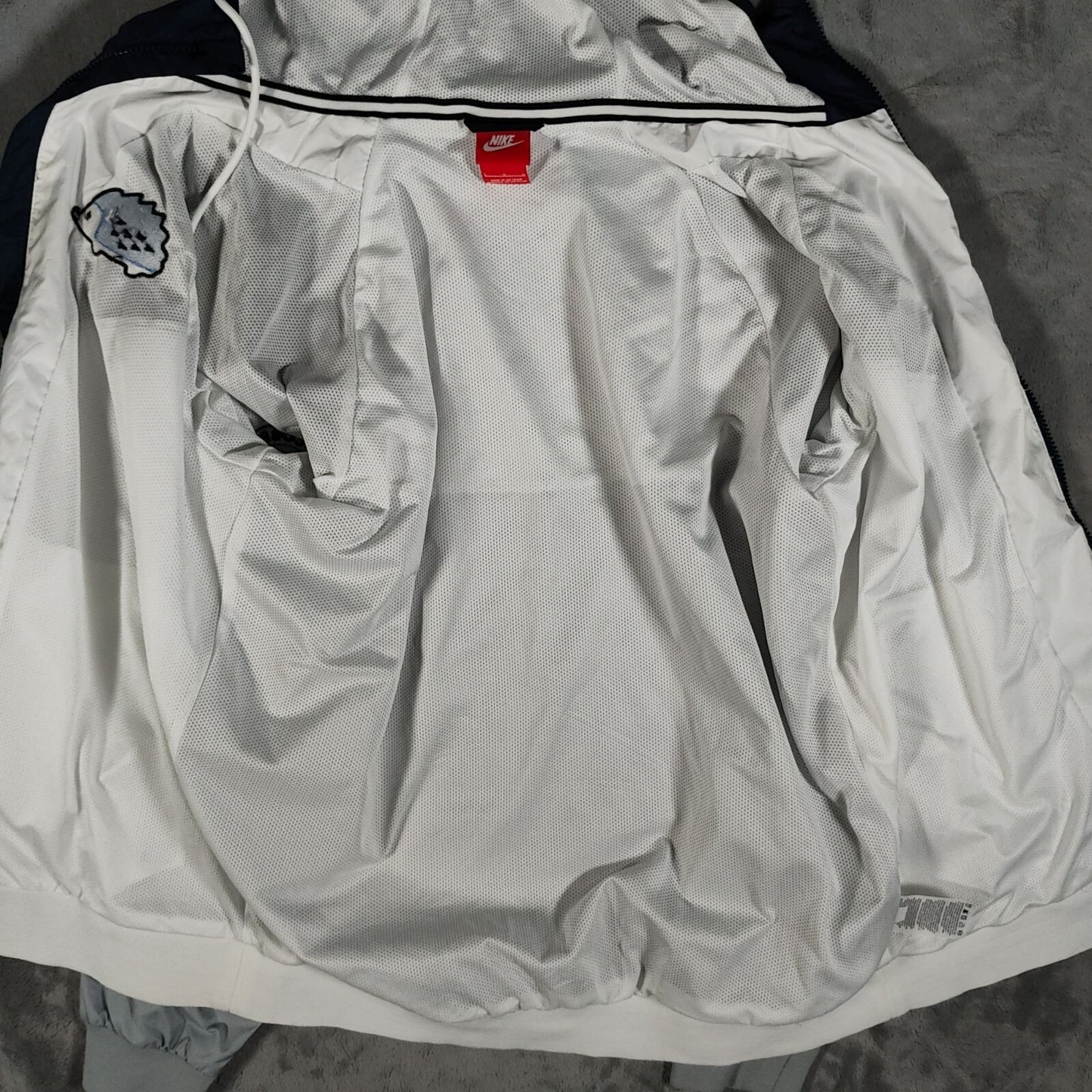 Nike Mens Windrunner East Cobb Lacrosse Hedgehogs Hooded Windbreaker Jacket (L)